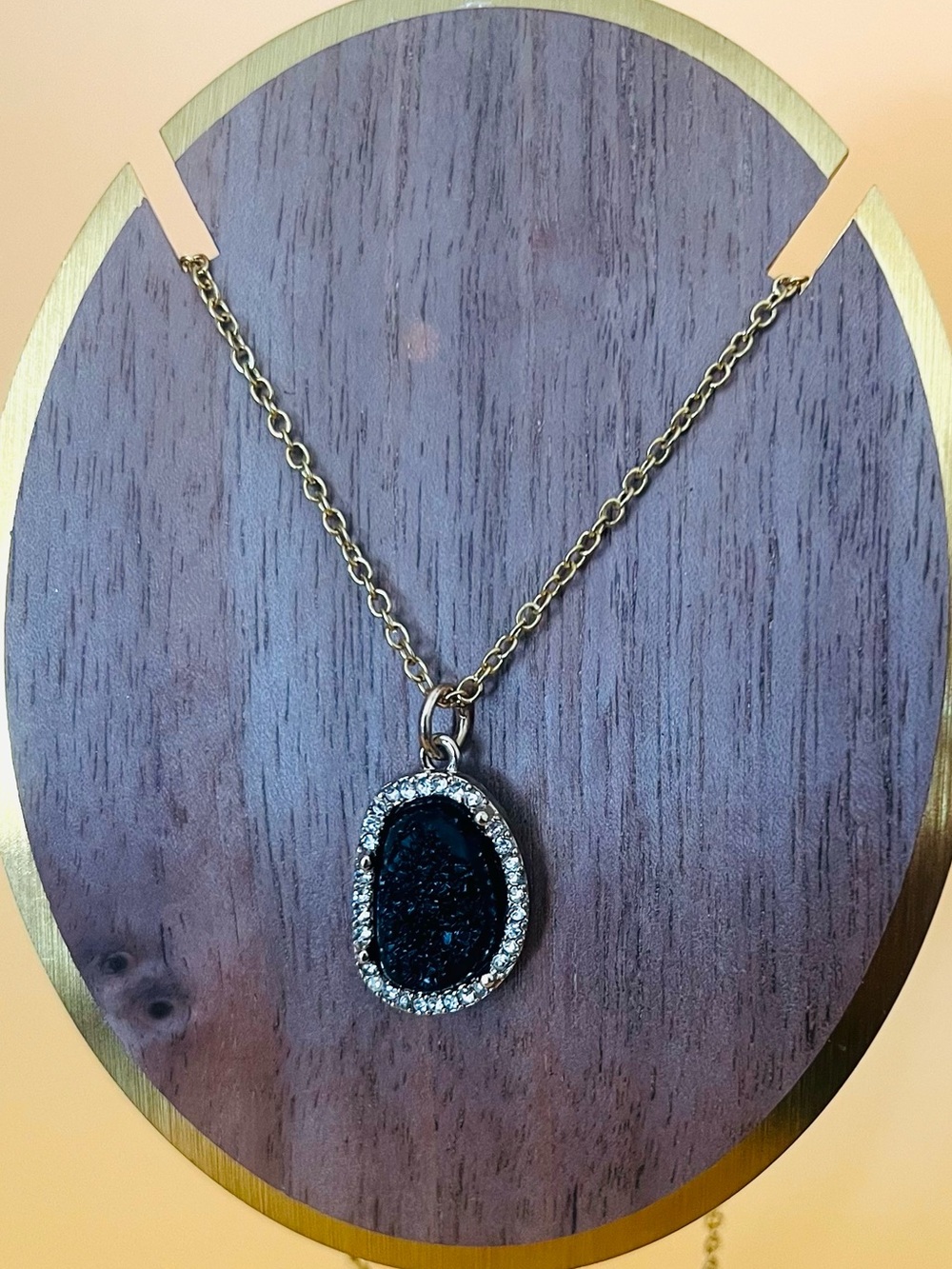Black and gold plated pendant plus matching necklace
